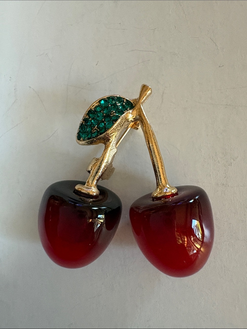 Cherry Pin Brooch with Gold Stem and Green Leaf Accents
